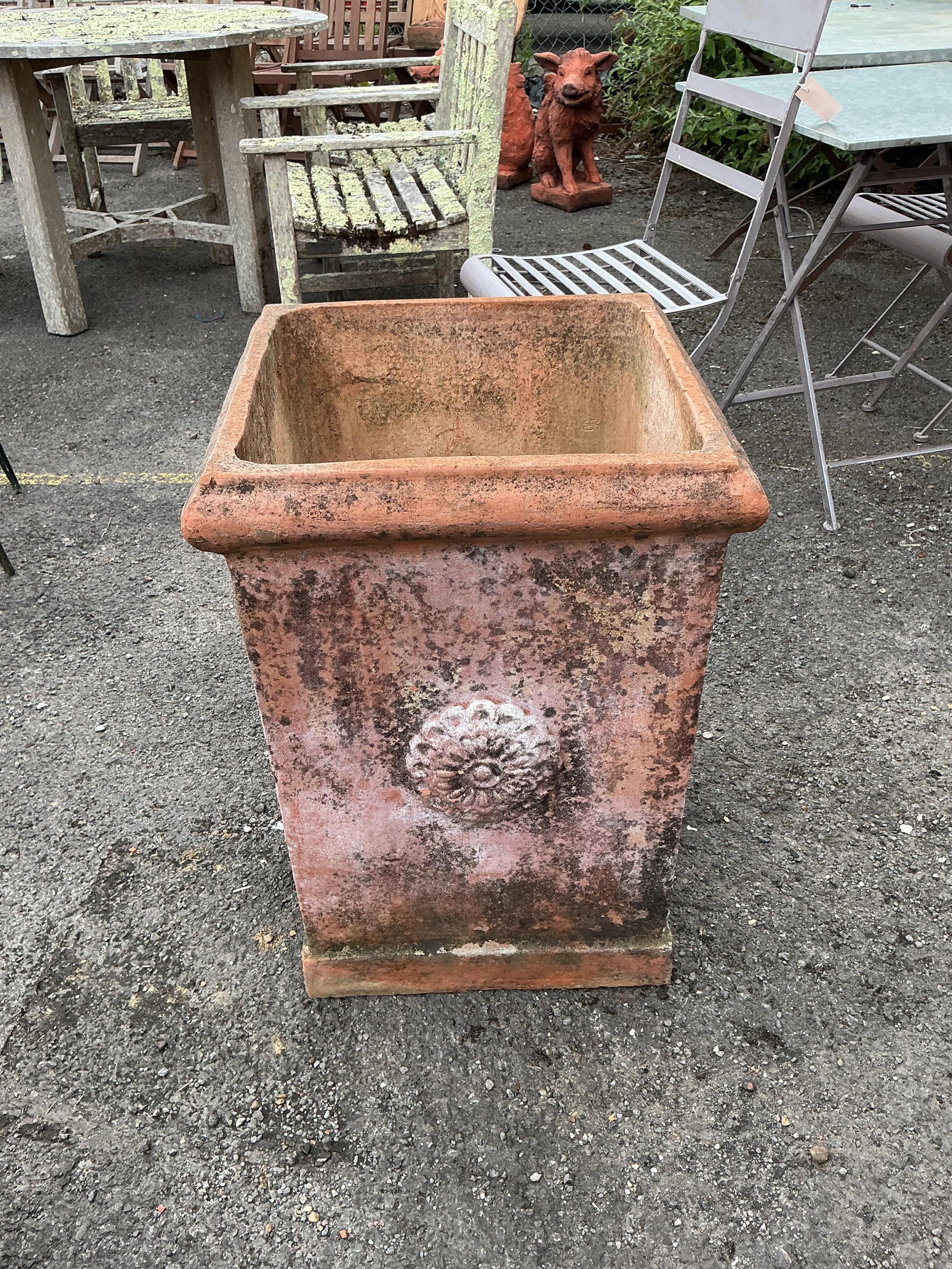 A large square terracotta garden planter, width 46cm, height 64cm